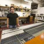 Vintage King Audio technician Jeff Spatafora looks over a refurbished Neve 8078 audio mixer at its warehouse in Ferndale. Vintage King specializes in providing vintage equipment to studios across the country. / Jarrad Henderson/Detroit Free Press