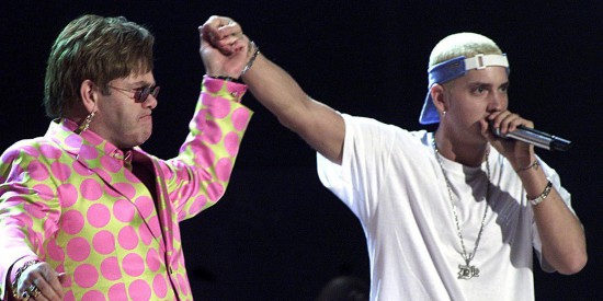 LOS ANGELES, UNITED STATES:  Elton John (L) joins rap musician Eminem (R) during their much anticipated performance at the 43rd Annual Grammy Awards 21 February 2001 at the Staples Center in Los Angeles. The controversial rapper Eminem won three Grammys despite anger over his lyrics, which critics revile as misogynist, anti-gay and violent.  AFP PHOTO/Hector MATA (Photo credit should read HECTOR MATA/AFP/Getty Images)