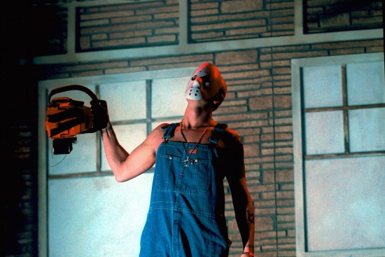 380673 04: Rapper Eminem dons a hockey mask and chainsaw onstage at his performance in New Jersey Meadowlands Arena October 19, 2000 in Secaucas, NJ. (Photo by George DeSota/Newsmakers)