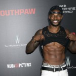 Tyson Beckford reveals his abs as he attends the premiere of Southpaw in New York July 21, 2015