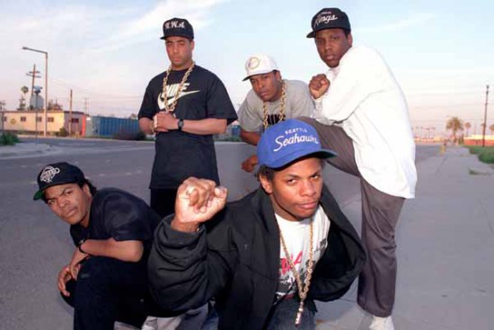 BACK: L-R: D.J. Yellr, Dr. Dre & M.C. Ren (Kings cap) and L-R: front--ICE CUBE (w/Raiders cap) and Ease E. (Seahawks cap) March 23, 1989 L. A. Times staff photo.