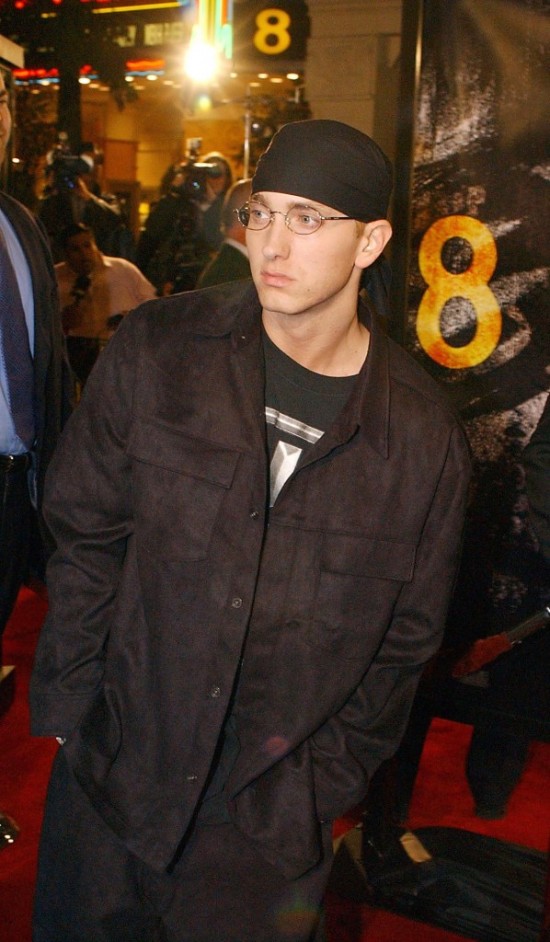 LOS ANGELES, CA - NOVEMBER 6:  Rap singer Eminem walks past photographers at the premiere of his film "8 Mile," 06 November 2002, in the Westwood section of Los Angeles. AP PHOTO/RENE MACURA  (Photo credit should read RENE MACURA/AFP/Getty Images)