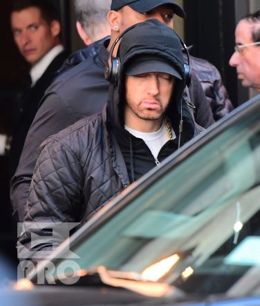 EXCLUSIVE: Eminem is notorious for his low-key lifestyle, so seeing him in public in NYC on Thursday was extremely rare. The rapper went incognito in a jacket, hoodie and baseball cap as he left a hotel in Manhattan surrounded by security guards. His face could be seen under his cap, and he appeared to be extremely tired, as he headed to an early morning rehearsal for Saturday Night Live.