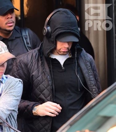 EXCLUSIVE: Eminem is notorious for his low-key lifestyle, so seeing him in public in NYC on Thursday was extremely rare. The rapper went incognito in a jacket, hoodie and baseball cap as he left a hotel in Manhattan surrounded by security guards. His face could be seen under his cap, and he appeared to be extremely tired, as he headed to an early morning rehearsal for Saturday Night Live.