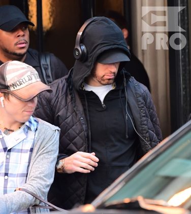 EXCLUSIVE: Eminem is notorious for his low-key lifestyle, so seeing him in public in NYC on Thursday was extremely rare. The rapper went incognito in a jacket, hoodie and baseball cap as he left a hotel in Manhattan surrounded by security guards. His face could be seen under his cap, and he appeared to be extremely tired, as he headed to an early morning rehearsal for Saturday Night Live.