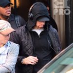 EXCLUSIVE: Eminem is notorious for his low-key lifestyle, so seeing him in public in NYC on Thursday was extremely rare. The rapper went incognito in a jacket, hoodie and baseball cap as he left a hotel in Manhattan surrounded by security guards. His face could be seen under his cap, and he appeared to be extremely tired, as he headed to an early morning rehearsal for Saturday Night Live.