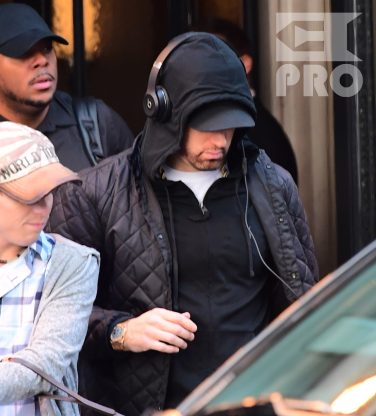 EXCLUSIVE: Eminem is notorious for his low-key lifestyle, so seeing him in public in NYC on Thursday was extremely rare. The rapper went incognito in a jacket, hoodie and baseball cap as he left a hotel in Manhattan surrounded by security guards. His face could be seen under his cap, and he appeared to be extremely tired, as he headed to an early morning rehearsal for Saturday Night Live.
