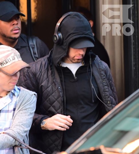 EXCLUSIVE: Eminem is notorious for his low-key lifestyle, so seeing him in public in NYC on Thursday was extremely rare. The rapper went incognito in a jacket, hoodie and baseball cap as he left a hotel in Manhattan surrounded by security guards. His face could be seen under his cap, and he appeared to be extremely tired, as he headed to an early morning rehearsal for Saturday Night Live.
