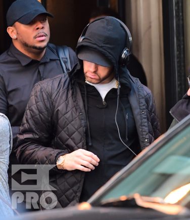EXCLUSIVE: Eminem is notorious for his low-key lifestyle, so seeing him in public in NYC on Thursday was extremely rare. The rapper went incognito in a jacket, hoodie and baseball cap as he left a hotel in Manhattan surrounded by security guards. His face could be seen under his cap, and he appeared to be extremely tired, as he headed to an early morning rehearsal for Saturday Night Live.