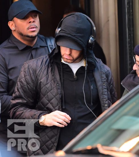 EXCLUSIVE: Eminem is notorious for his low-key lifestyle, so seeing him in public in NYC on Thursday was extremely rare. The rapper went incognito in a jacket, hoodie and baseball cap as he left a hotel in Manhattan surrounded by security guards. His face could be seen under his cap, and he appeared to be extremely tired, as he headed to an early morning rehearsal for Saturday Night Live.