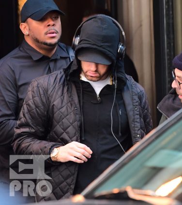 EXCLUSIVE: Eminem is notorious for his low-key lifestyle, so seeing him in public in NYC on Thursday was extremely rare. The rapper went incognito in a jacket, hoodie and baseball cap as he left a hotel in Manhattan surrounded by security guards. His face could be seen under his cap, and he appeared to be extremely tired, as he headed to an early morning rehearsal for Saturday Night Live.