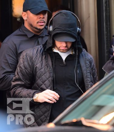 EXCLUSIVE: Eminem is notorious for his low-key lifestyle, so seeing him in public in NYC on Thursday was extremely rare. The rapper went incognito in a jacket, hoodie and baseball cap as he left a hotel in Manhattan surrounded by security guards. His face could be seen under his cap, and he appeared to be extremely tired, as he headed to an early morning rehearsal for Saturday Night Live.