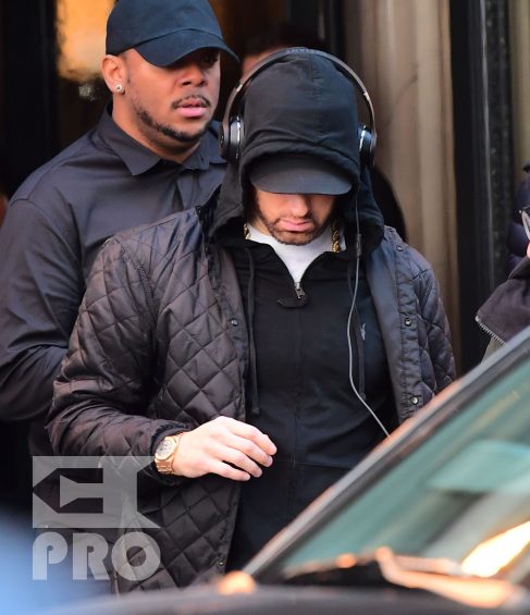 EXCLUSIVE: Eminem is notorious for his low-key lifestyle, so seeing him in public in NYC on Thursday was extremely rare. The rapper went incognito in a jacket, hoodie and baseball cap as he left a hotel in Manhattan surrounded by security guards. His face could be seen under his cap, and he appeared to be extremely tired, as he headed to an early morning rehearsal for Saturday Night Live.