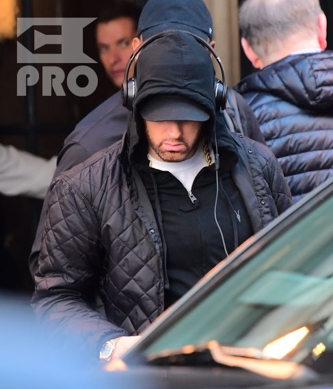 EXCLUSIVE: Eminem is notorious for his low-key lifestyle, so seeing him in public in NYC on Thursday was extremely rare. The rapper went incognito in a jacket, hoodie and baseball cap as he left a hotel in Manhattan surrounded by security guards. His face could be seen under his cap, and he appeared to be extremely tired, as he headed to an early morning rehearsal for Saturday Night Live.