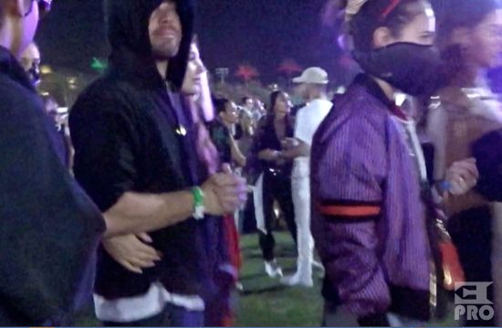 EXCLUSIVE: Leonardo DiCaprio gets many hugs and a kiss from his new girlfriend as she showed much affection moments before the Eminem performance at Coachella. Camila Morrone (20) was having a blast with Leo as they stood with friends next to the VIP cash bar and then later held each other and squeezed their way through a pipe structure all while holding each other close and then made their way to the lawn to watch the big show of the final night of Coachella.