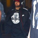 New York, NY - *EXCLUSIVE* - Eminem quickly heads to his car after leaving his hotel. Eminem doesn't have the time to stop and talk to fans as he waves instead and hops into his ride.