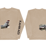 This is a pre-order and is expected to ship in 4-5 weeks.  ﻿Exclusive and limited Kamikaze merchandise.  Plane from the official Kamikaze album art wraps around the right side with Kamikaze printed in black on the left arm of a sandstone crew neck.